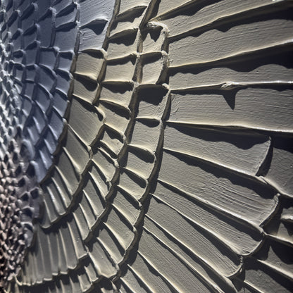 Close side view of Kanso Flux layered concentric relief texture