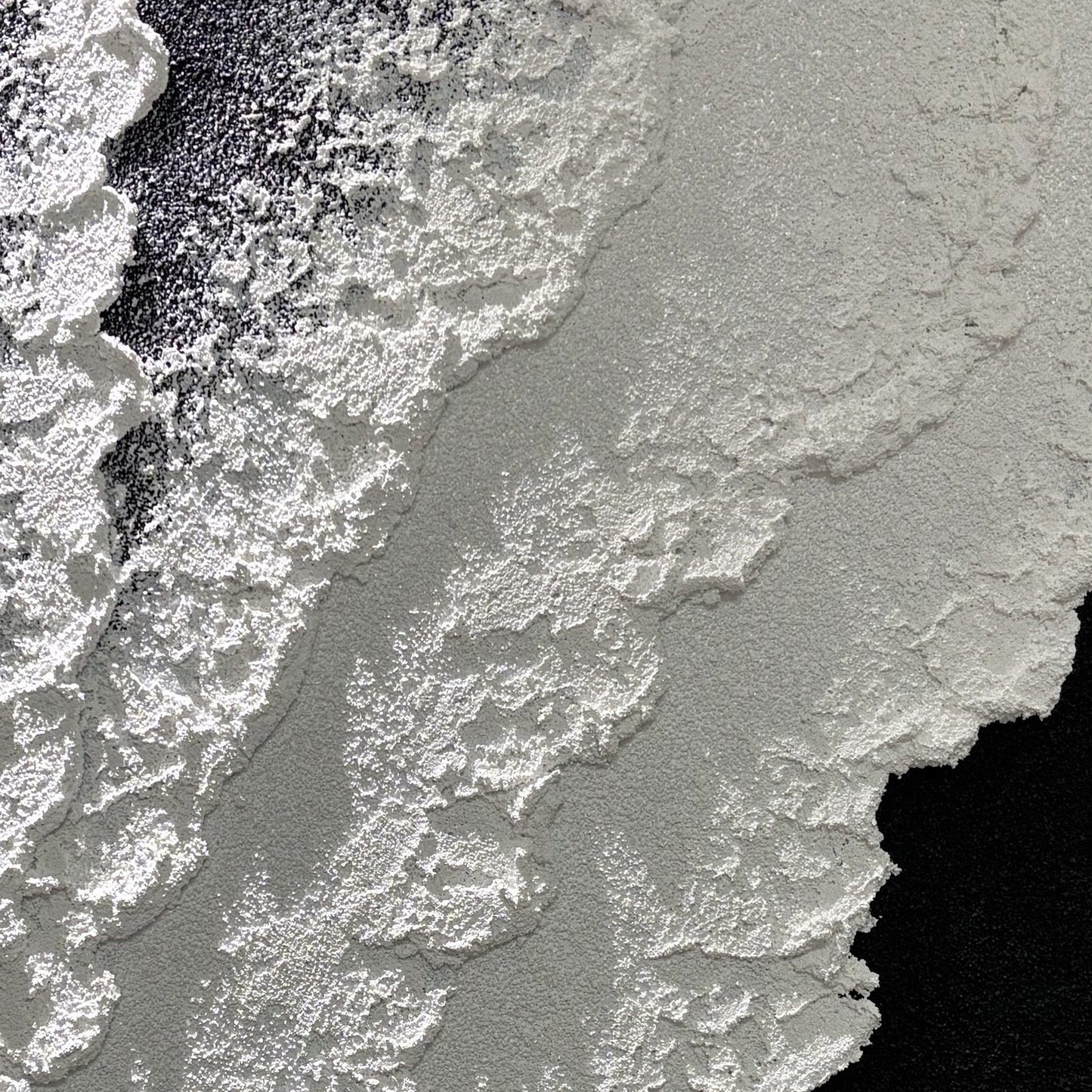 Close view of Vestige of Silence matte black and white grain