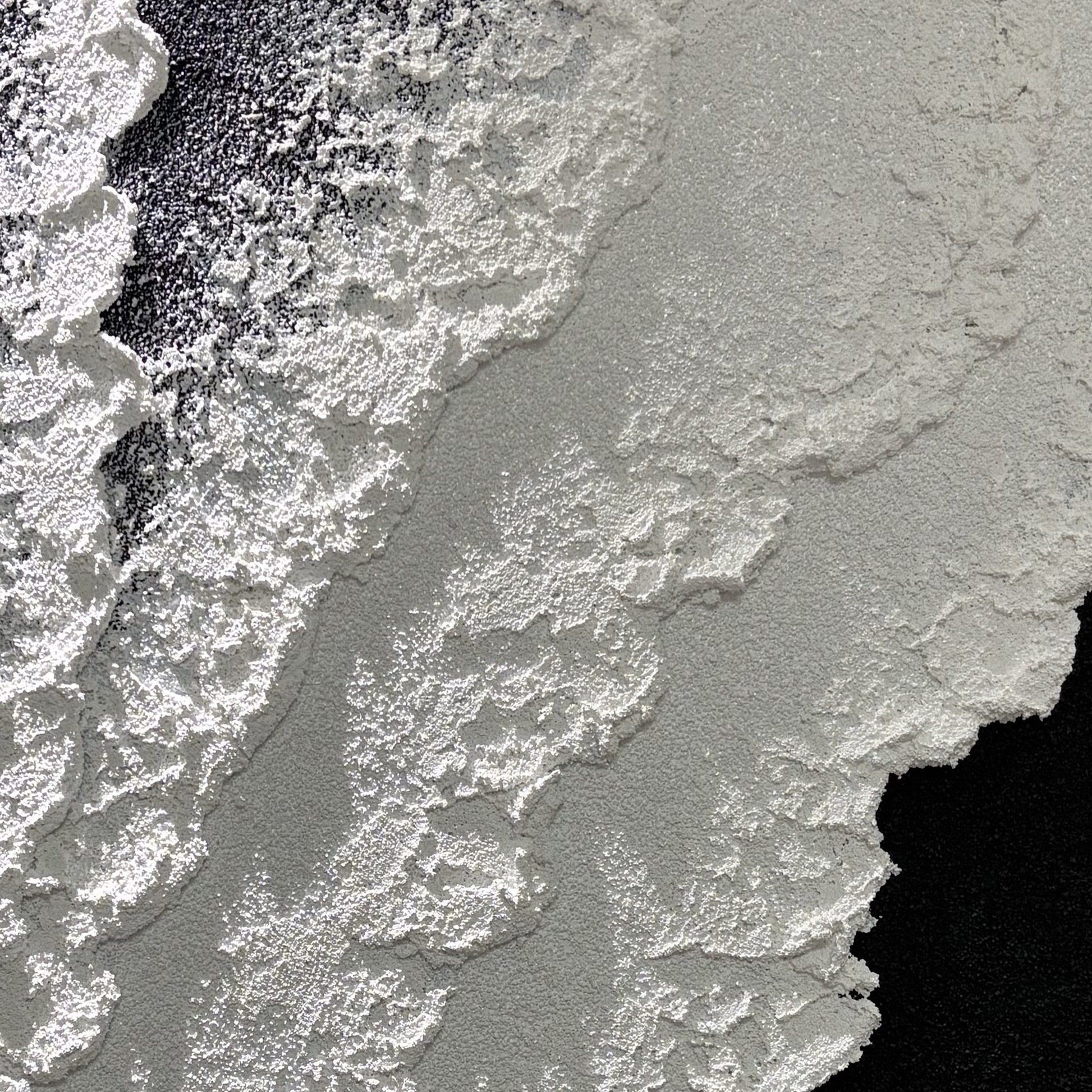 Close view of Vestige of Silence matte black and white grain