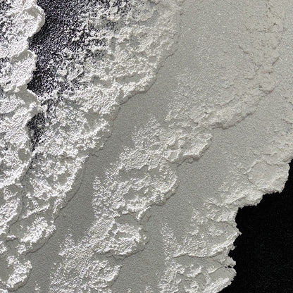 Close view of Vestige of Silence matte black and white grain