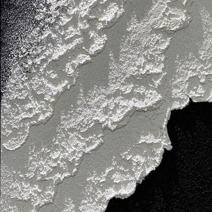 Close view of Vestige of Silence raised edges in directional light