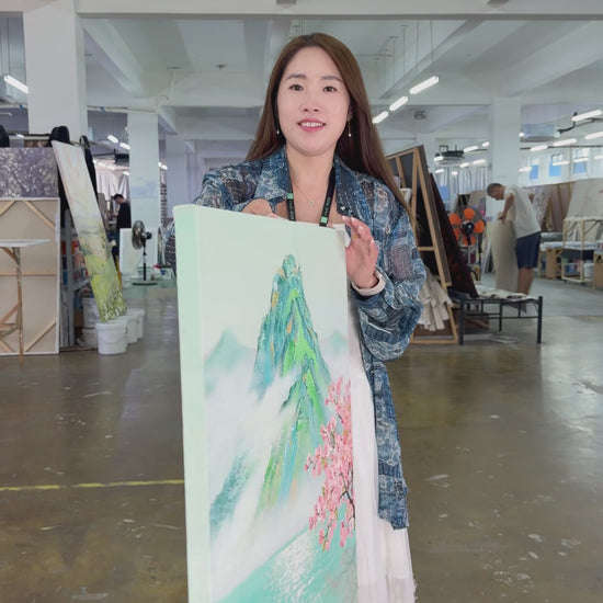 Workshop video showing the hand-painted misty mountain and turquoise lake artwork turning from an angled view to a complete frontal view