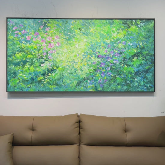 Real video of pink and violet painted flowers, green foliage and ridged paint details, ending with the full artwork above a sofa