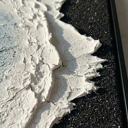 Close view of Silence in Onyx white surf and black textured shore